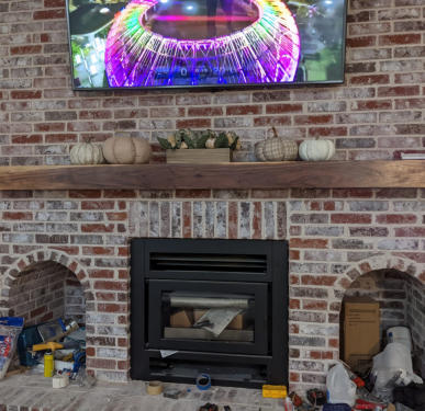 This is a picture of a fireplace renovation that was constructed by Slinkard Enterprise in Grove OK